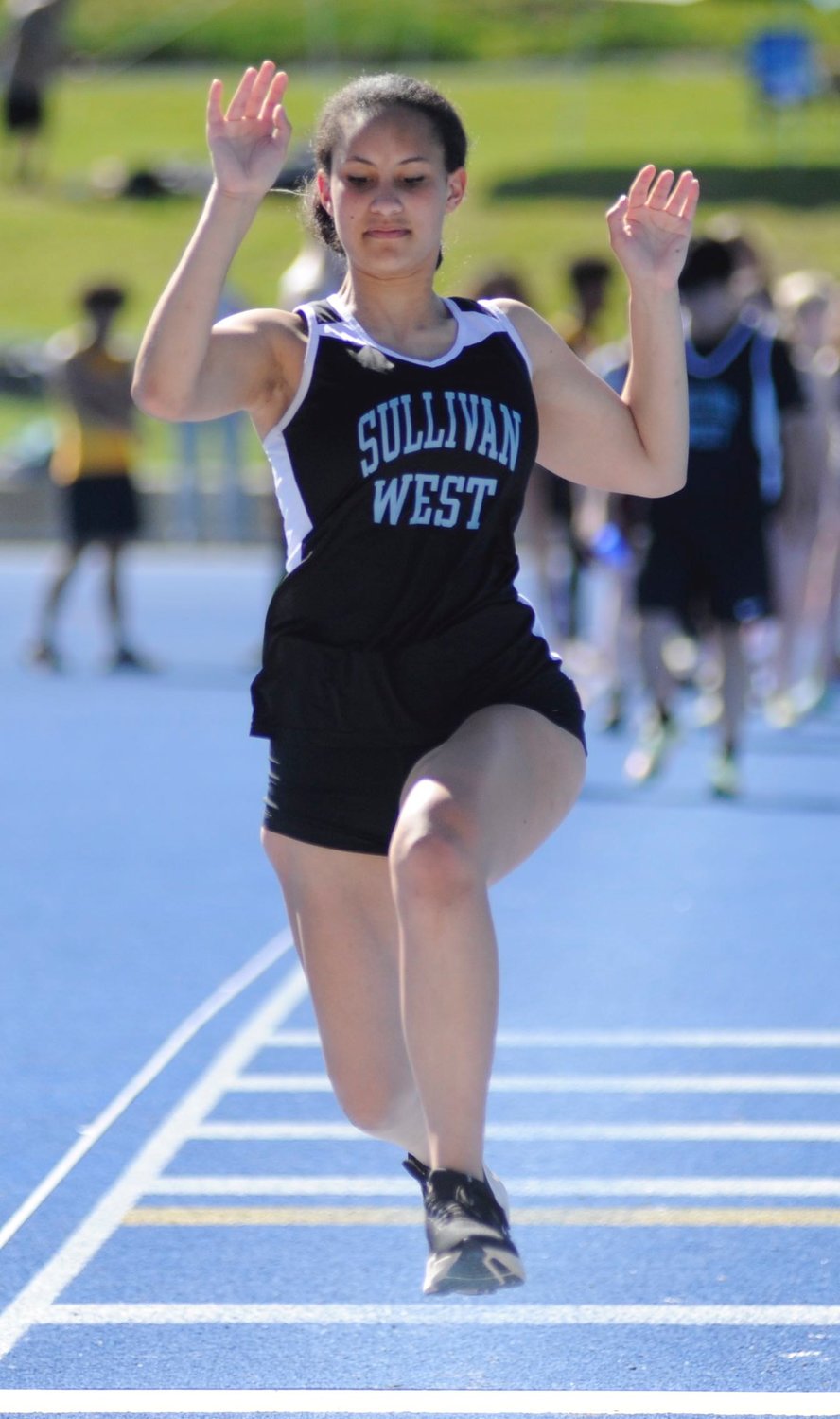 Taking off.  Sullivan West’s Brooke DeCarlo competes in the long jump.